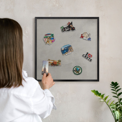 Vacation magnet board with a black frame Gray background
