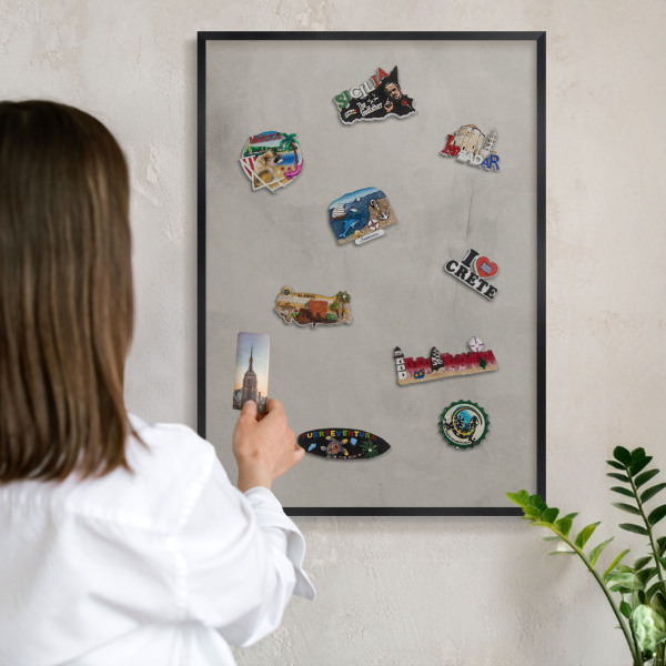 Vacation magnet board with a black frame Gray background