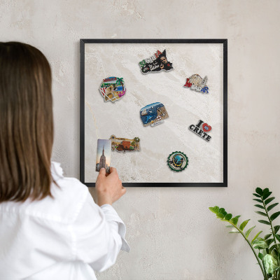 Metal wall board for magnets in a black frame Creamy elegance