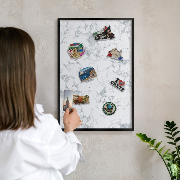 Metal wall board for magnets in a black frame Marble aesthetics