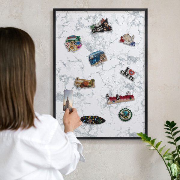 Metal wall board for magnets in a black frame Marble aesthetics