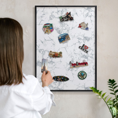 Metal wall board for magnets in a black frame Marble aesthetics