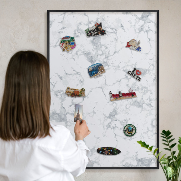 Metal wall board for magnets in a black frame Marble aesthetics