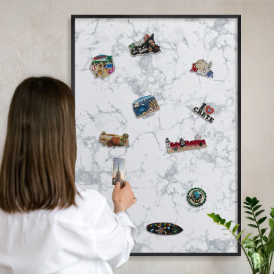 Metal wall board for magnets in a black frame Marble aesthetics