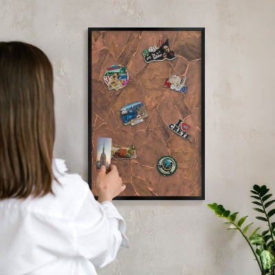 Metal wall board for magnets in a black frame Stone structure