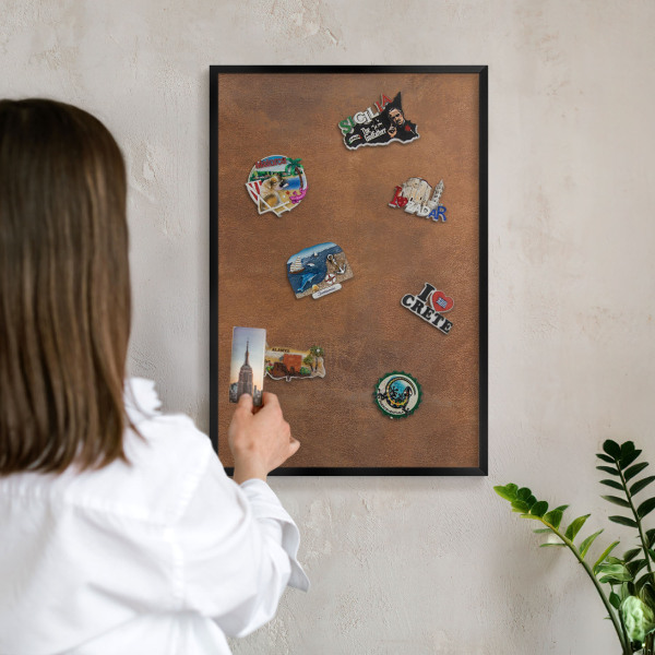 Metal wall board for magnets in a black frame Brown texture