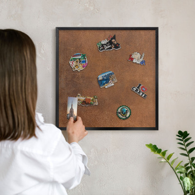 Metal wall board for magnets in a black frame Brown texture