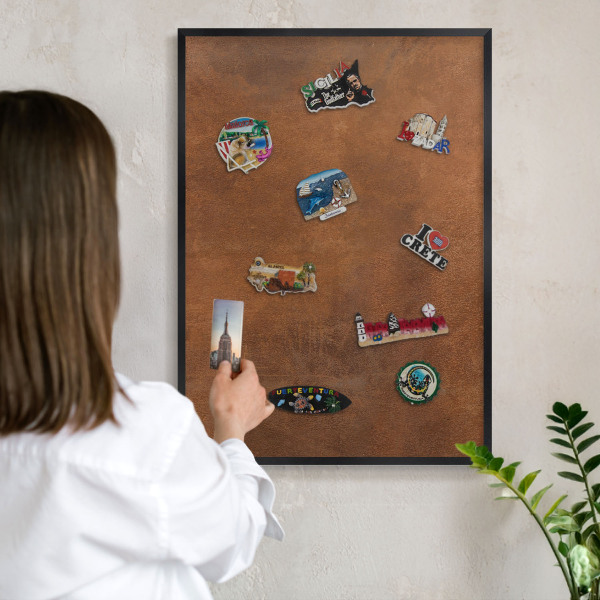 Metal wall board for magnets in a black frame Brown texture
