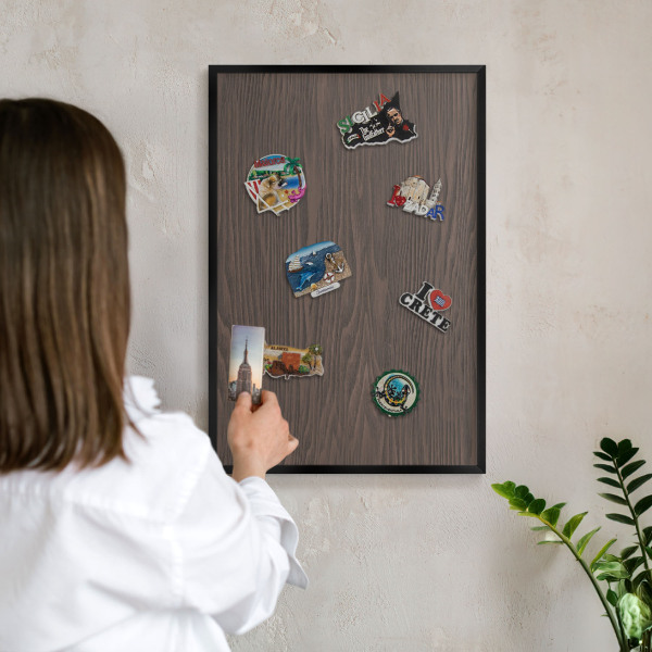 Metal wall board for magnets in a black frame Natural wood