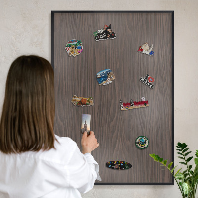 Metal wall board for magnets in a black frame Natural wood