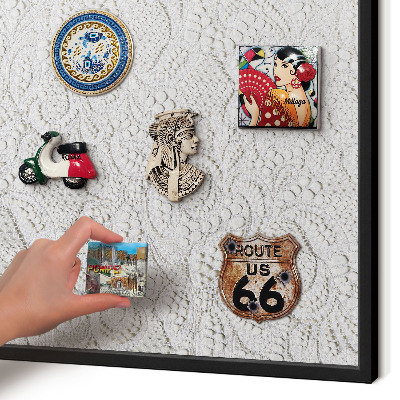 Metal wall board for magnets in a black frame Openwork elegance