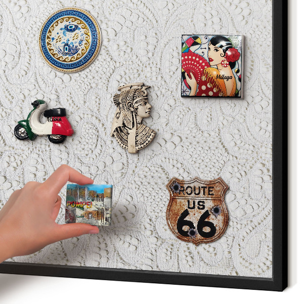 Metal wall board for magnets in a black frame Openwork elegance