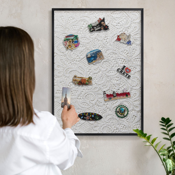 Metal wall board for magnets in a black frame Openwork elegance