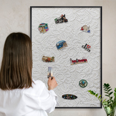 Metal wall board for magnets in a black frame Openwork elegance