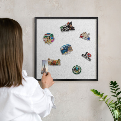 Metal wall board for magnets in a black frame White texture