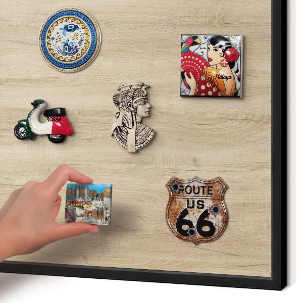 Vacation magnet board with a black frame Wooden background
