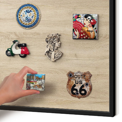 Vacation magnet board with a black frame Wooden background