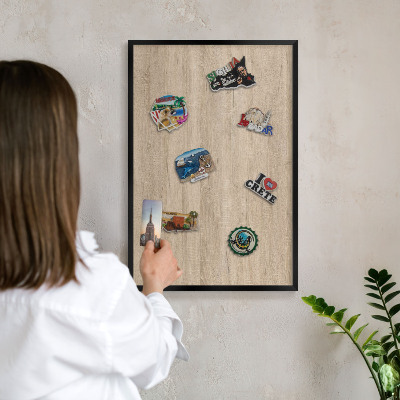 Vacation magnet board with a black frame Wooden background