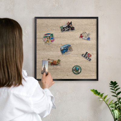 Vacation magnet board with a black frame Wooden background