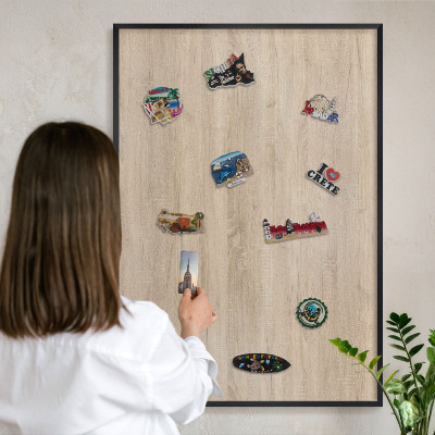 Vacation magnet board with a black frame Wooden background