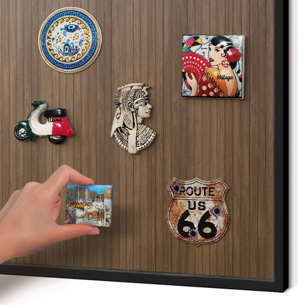 Metal wall board for magnets in a black frame Wooden background