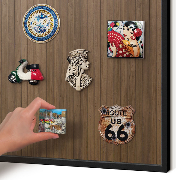 Metal wall board for magnets in a black frame Wooden background