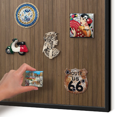 Metal wall board for magnets in a black frame Wooden background