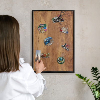 Metal wall board for magnets in a black frame Natural wood