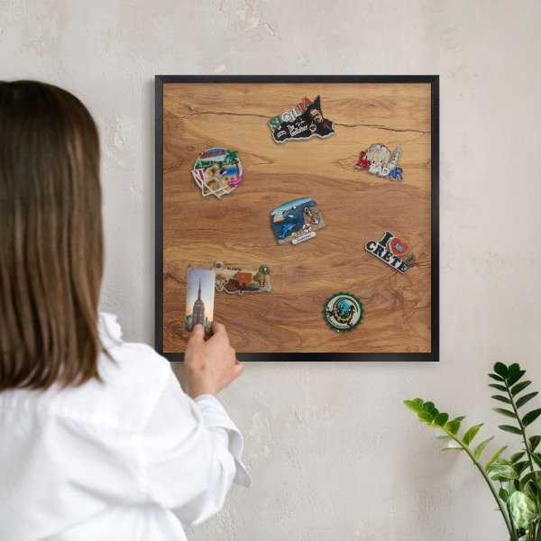Metal wall board for magnets in a black frame Natural wood