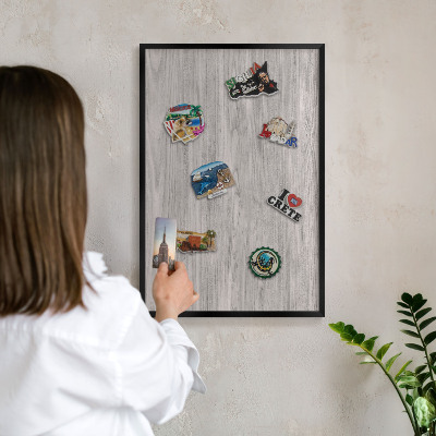 Vacation magnet board with a black frame Wooden texture