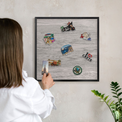 Vacation magnet board with a black frame Wooden texture