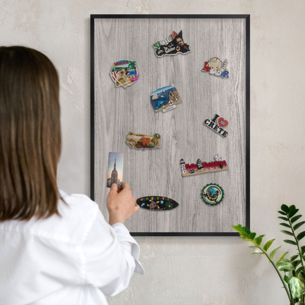 Vacation magnet board with a black frame Wooden texture