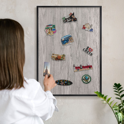 Vacation magnet board with a black frame Wooden texture