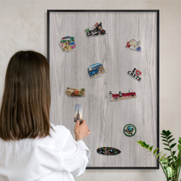 Vacation magnet board with a black frame Wooden texture