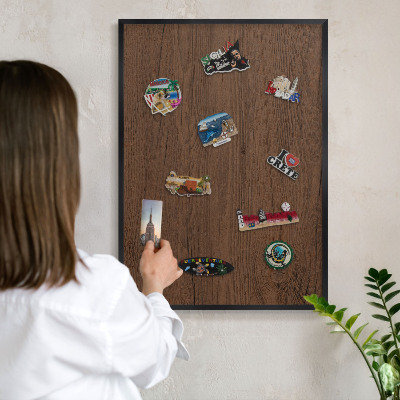 Metal wall board for magnets in a black frame Wooden texture