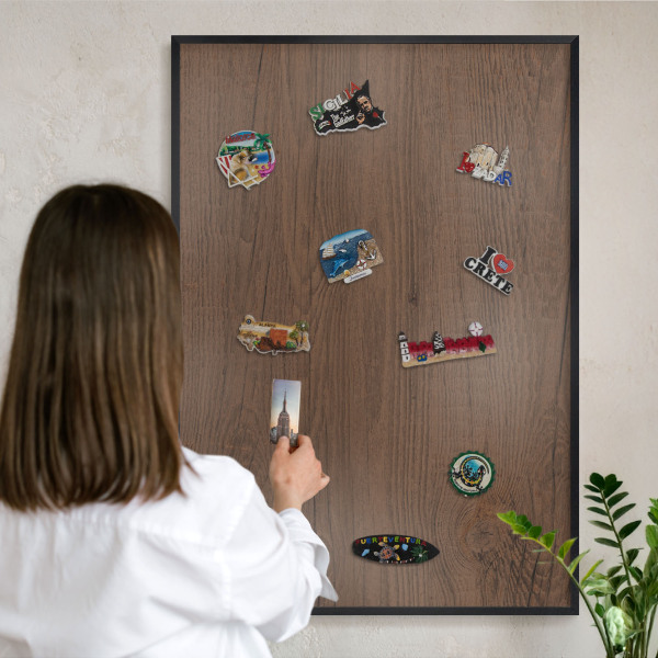 Metal wall board for magnets in a black frame Wooden texture