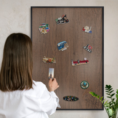Metal wall board for magnets in a black frame Wooden texture