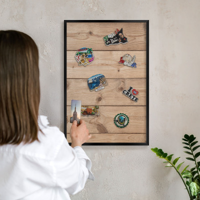 Metal wall board for magnets in a black frame Wooden texture