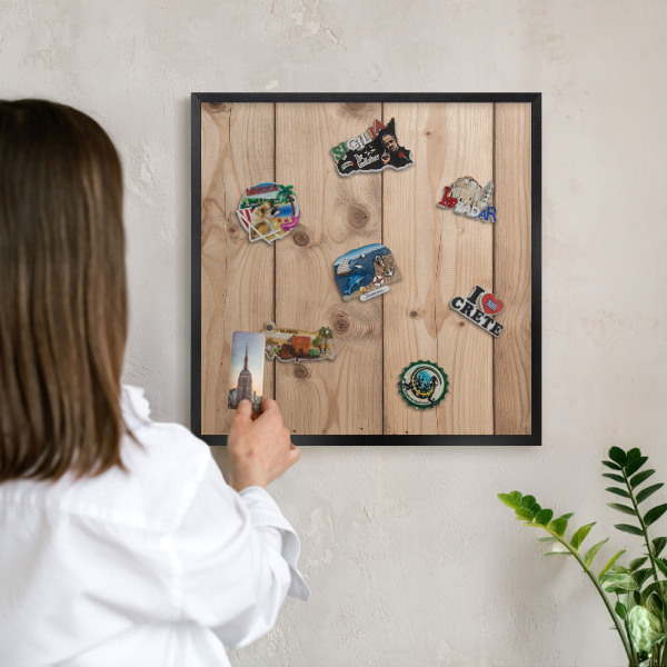 Metal wall board for magnets in a black frame Wooden texture