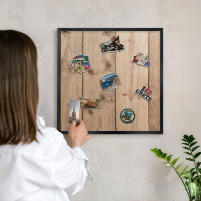 Metal wall board for magnets in a black frame Wooden texture