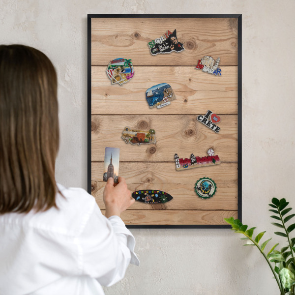 Metal wall board for magnets in a black frame Wooden texture