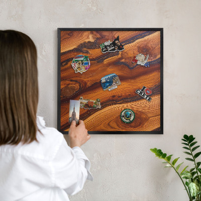 Metal wall board for magnets in a black frame Wooden rings