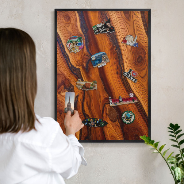 Metal wall board for magnets in a black frame Wooden rings