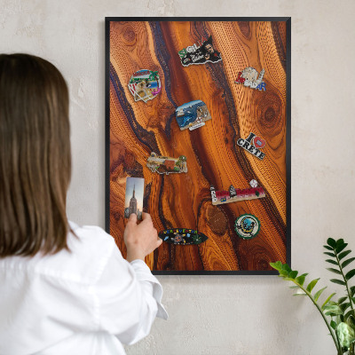Metal wall board for magnets in a black frame Wooden rings