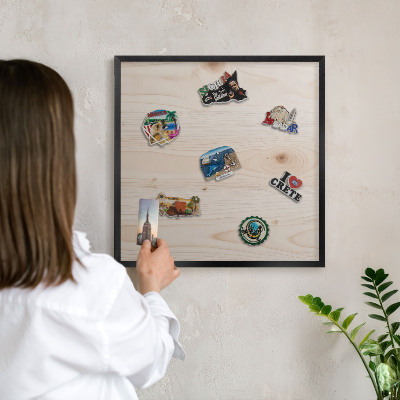 Metal wall board for magnets in a black frame Wooden pattern