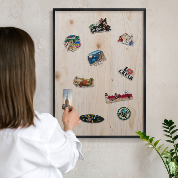 Metal wall board for magnets in a black frame Wooden pattern