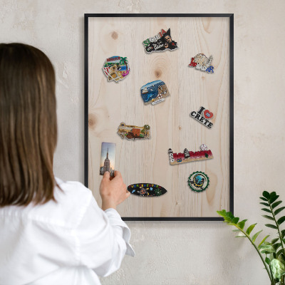 Metal wall board for magnets in a black frame Wooden pattern
