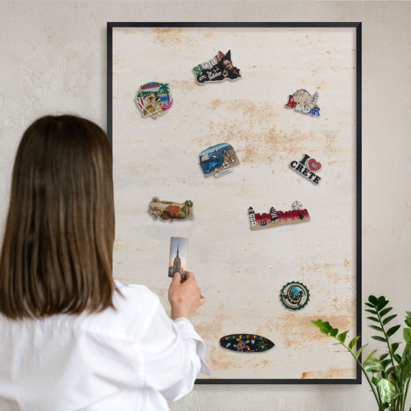Metal wall board for magnets in a black frame Rusty texture