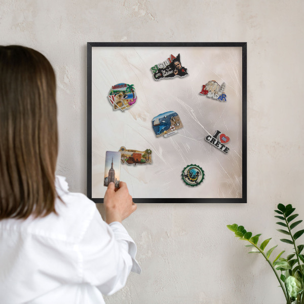 Metal wall board for magnets in a black frame Soft lightness