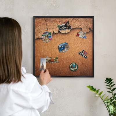 Metal wall board for magnets in a black frame Wooden texture